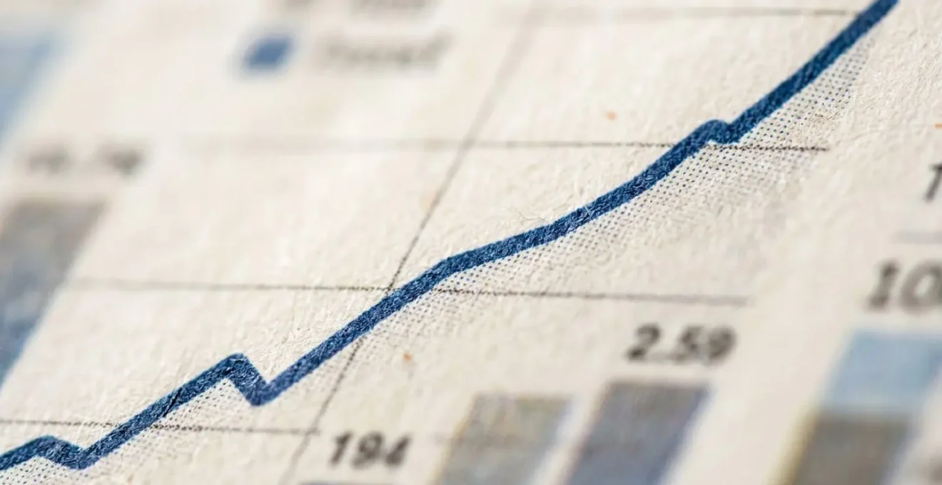 Extreme close-up of financial growth chart with selective focus on upward trend